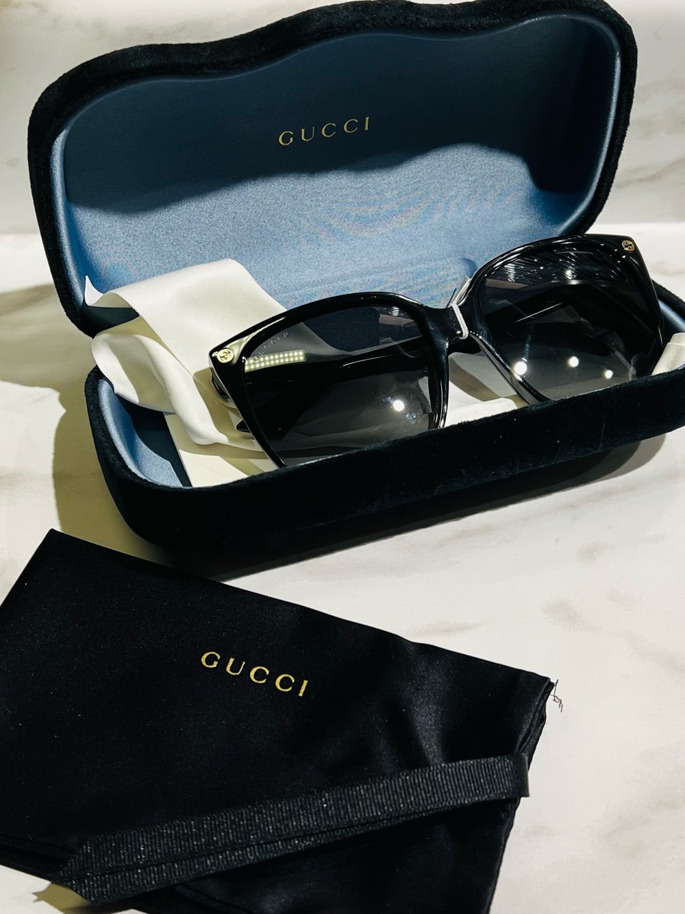 Gucci Black Cat-Eye Sunglasses with Gold Accents